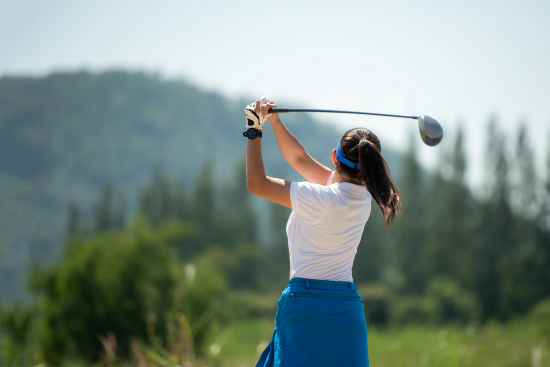 Female Golfer Teeing Off Home