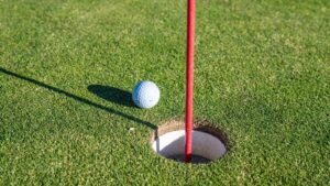 a golf ball that didn't quite go into the hole