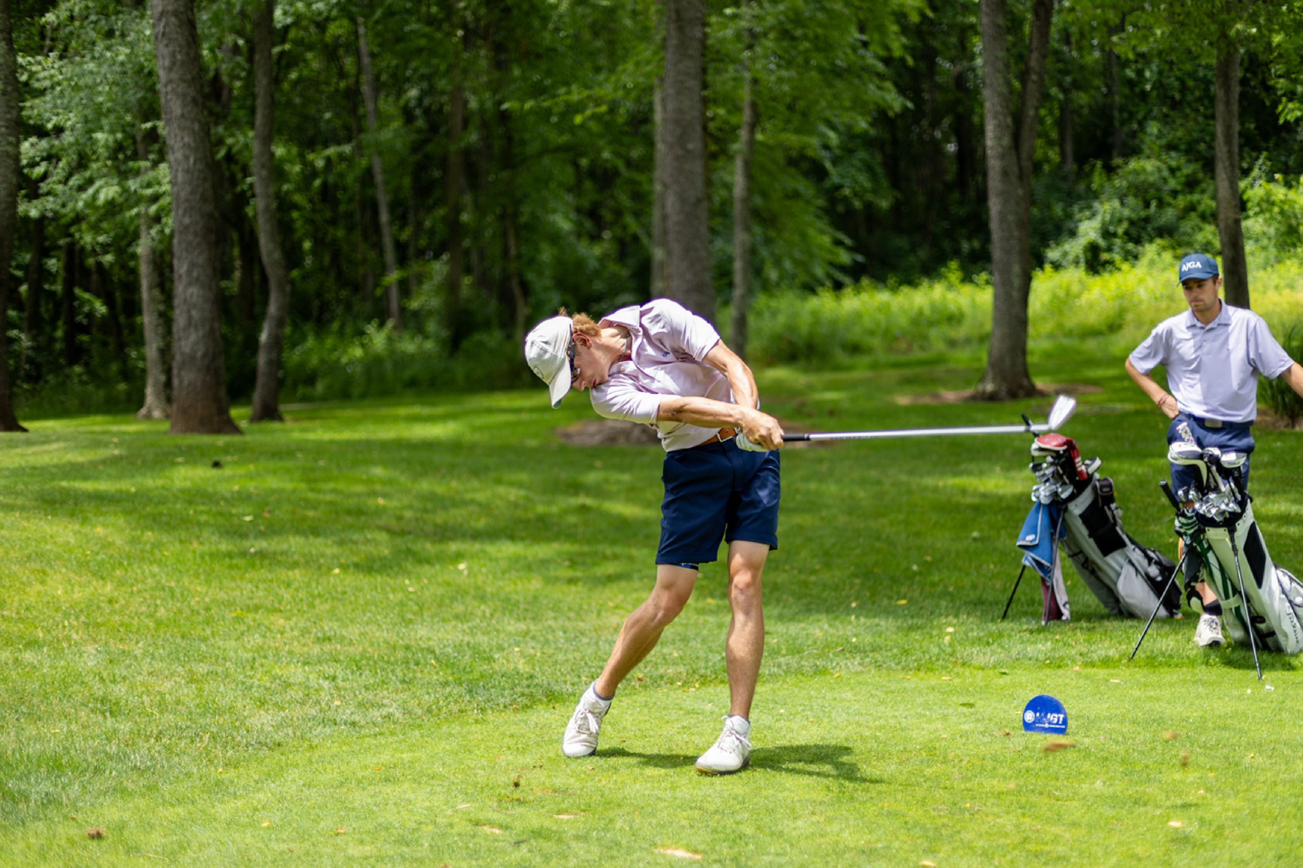Young Golfer Teeing Off